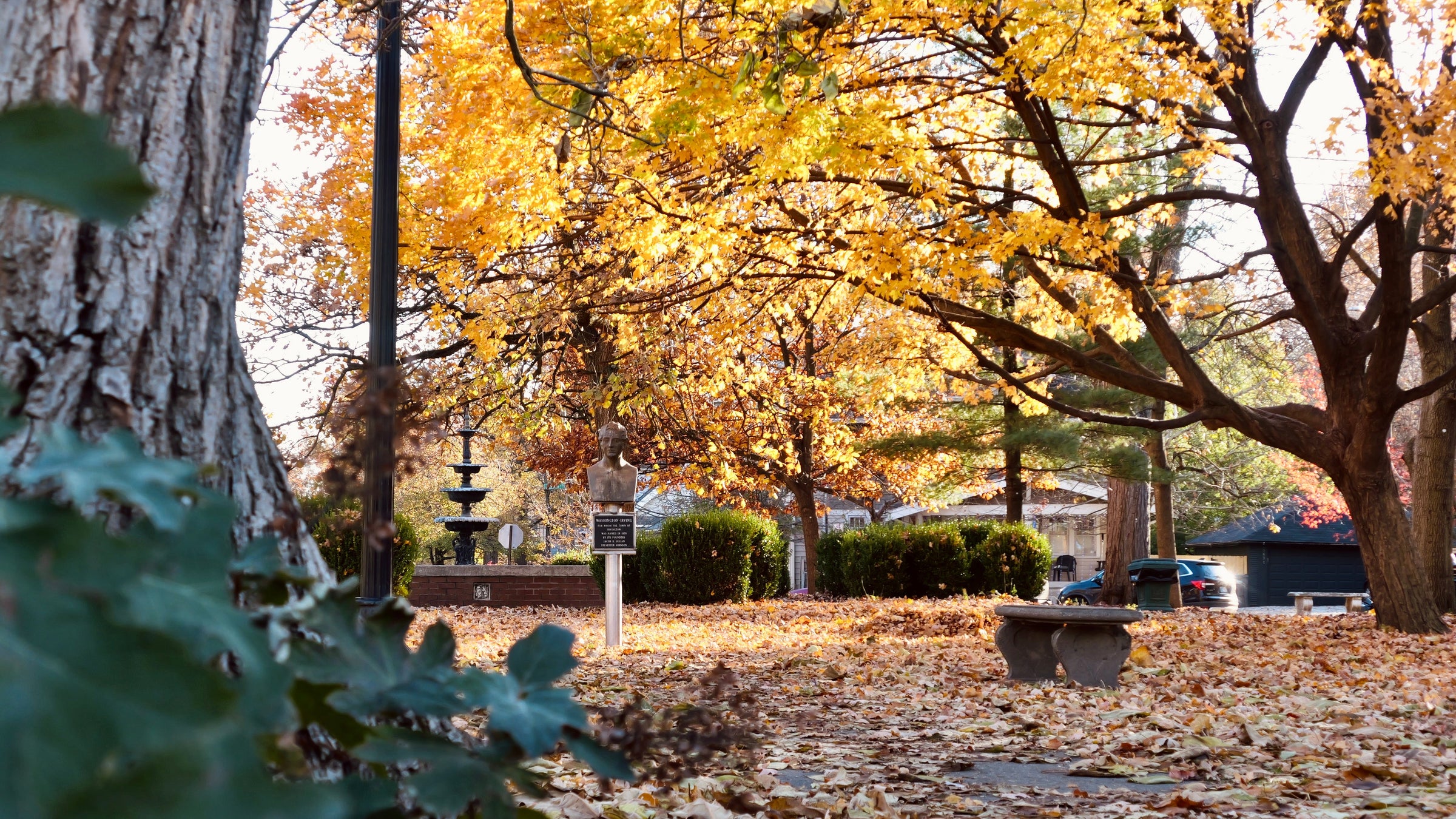 Irving Circle Park in autumn with golden trees and fountain, Irvington Indianapolis — photo by Kelby Dolan